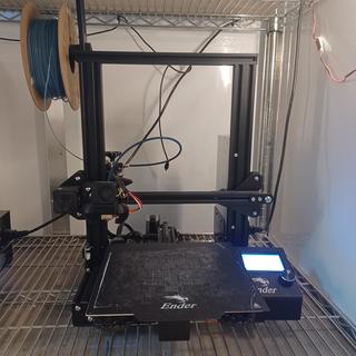 Ender 3 pro 3d printer sitting on a shelf